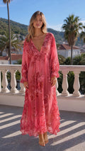 Front view of model wearing pink floral long sleeve maxi dress