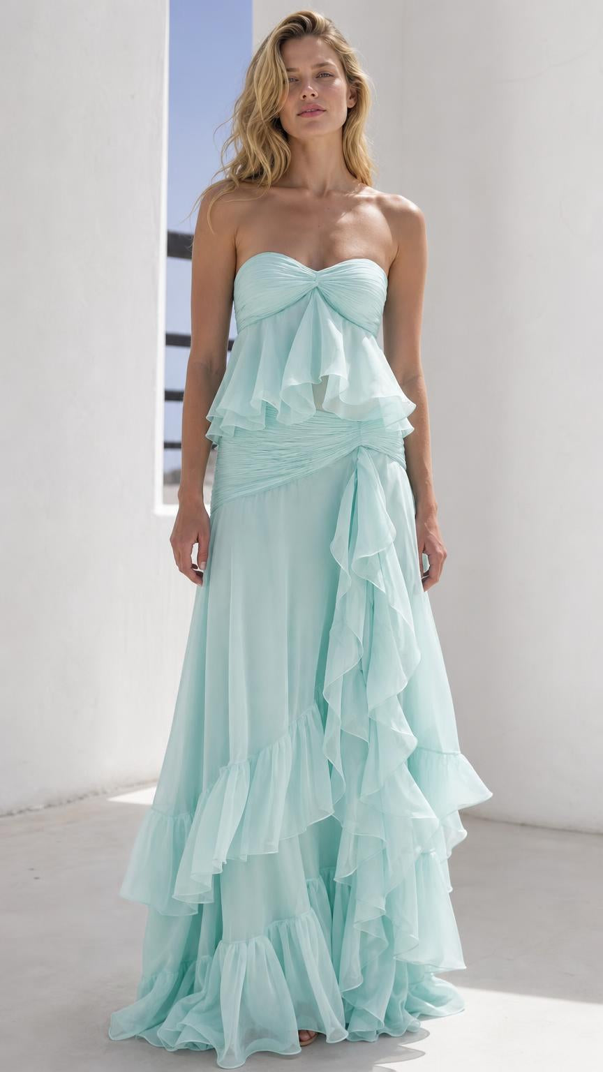 Front view of model wearing mint green strapless ruffled maxi dress