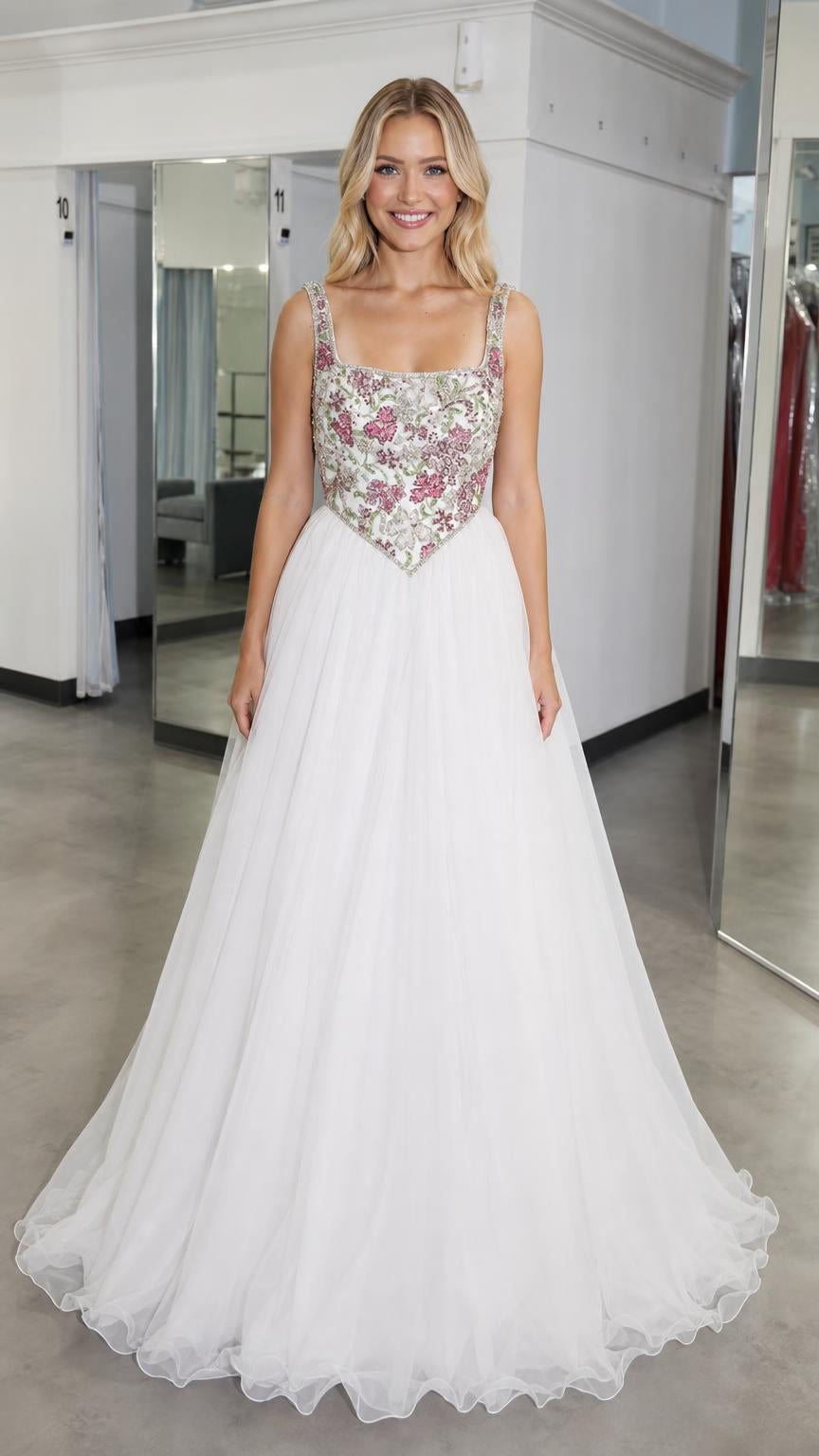 Front view of white embroidered bodice tulle ball gown