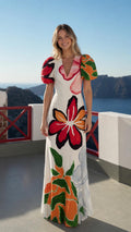 Model wearing white floral puff sleeve maxi dress from the front