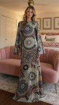Front view of model wearing sage mandola print long sleeve maxi dress