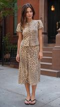 Front full view of woman wearing brown leopard print matching set