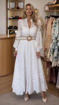Front view of model wearing white boho chic long sleeve maxi dress