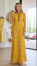 Front view of woman wearing mustard yellow long-sleeve lace maxi dress
