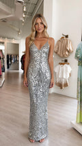 Front view of model wearing silver sequin maxi dress