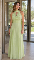 Front view of model wearing sage green halter maxi dress