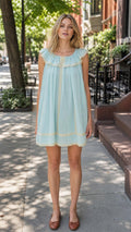 Front view of light blue ruffled mini dress