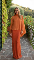 Front view of orange cape overlay maxi dress