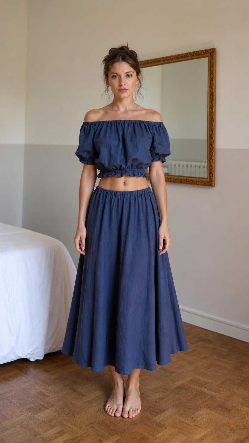 Front view of woman wearing blue off-shoulder crop top and midi skirt set