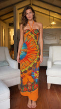 Front view of model wearing orange halter maxi dress