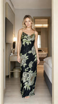 Front view of model wearing black floral maxi slip dress