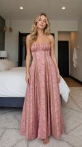 Front view of model wearing pink boho floral smocked maxi dress