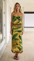 Model wearing yellow tropical banana leaf print cami top and midi skirt set with beaded fringe from the front