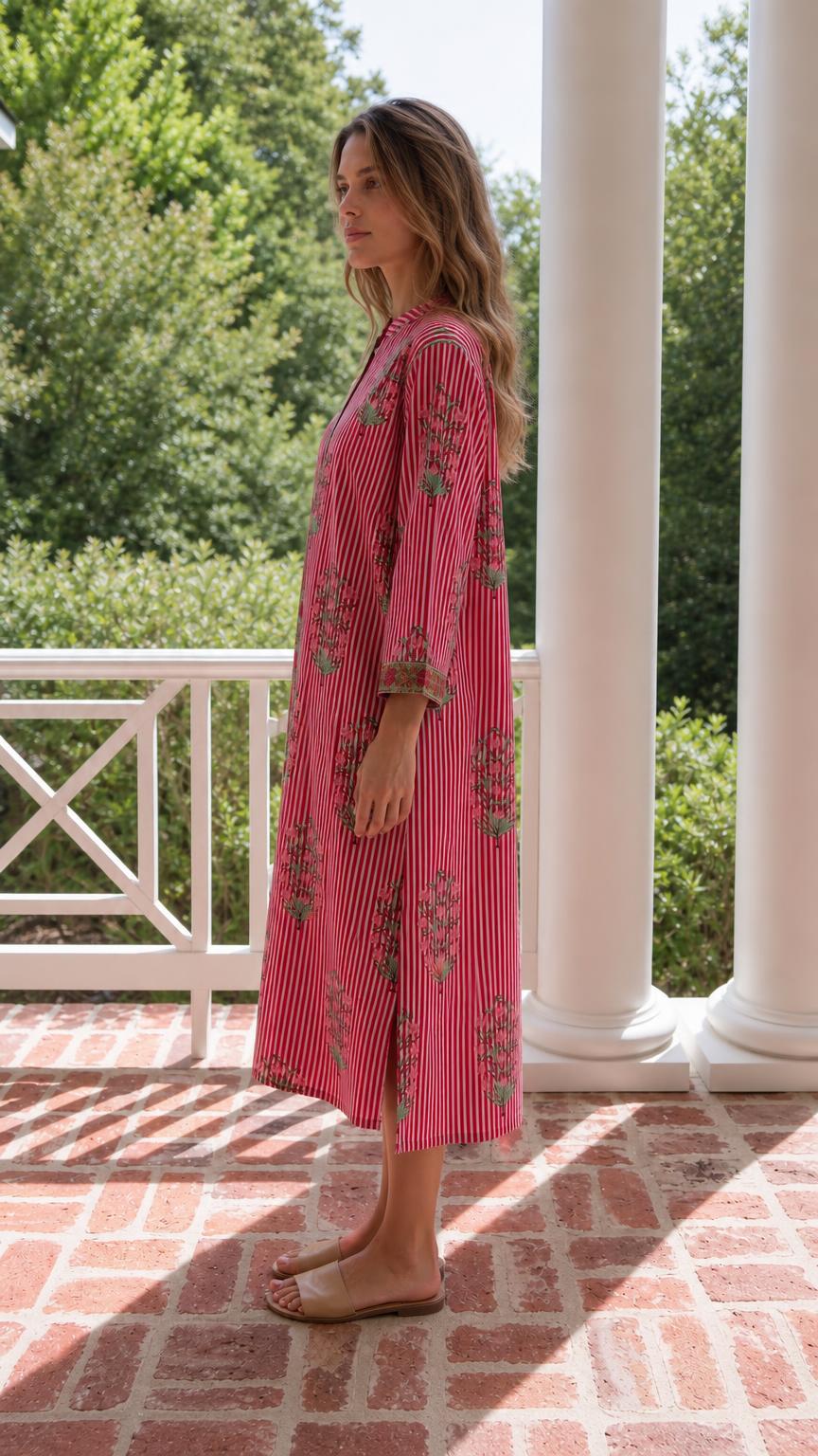 Side profile of model in red striped midi dress