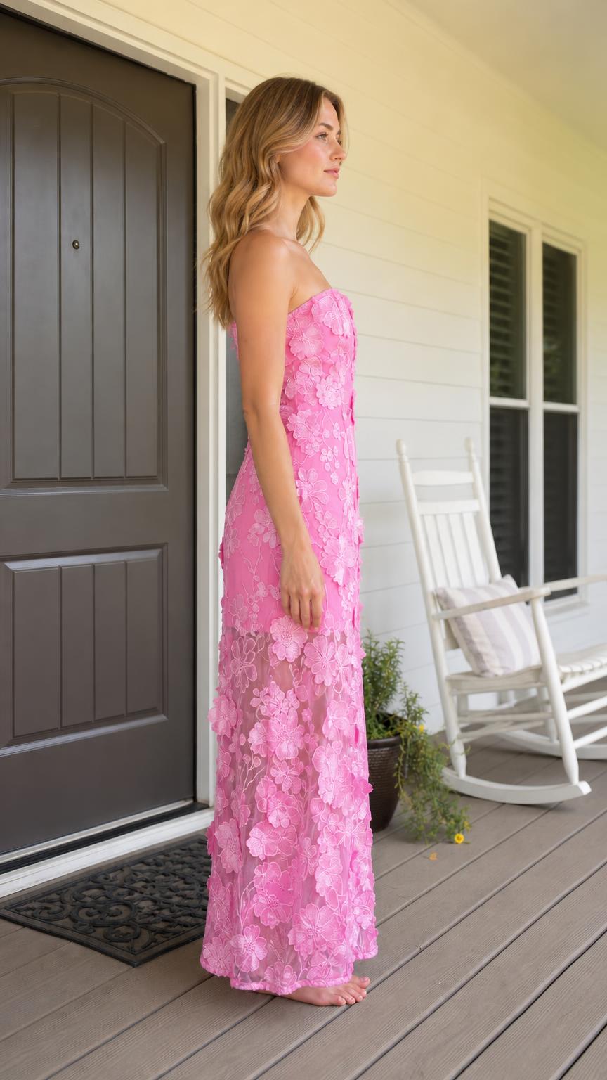 Side view of model wearing pink 3D floral strapless maxi dress