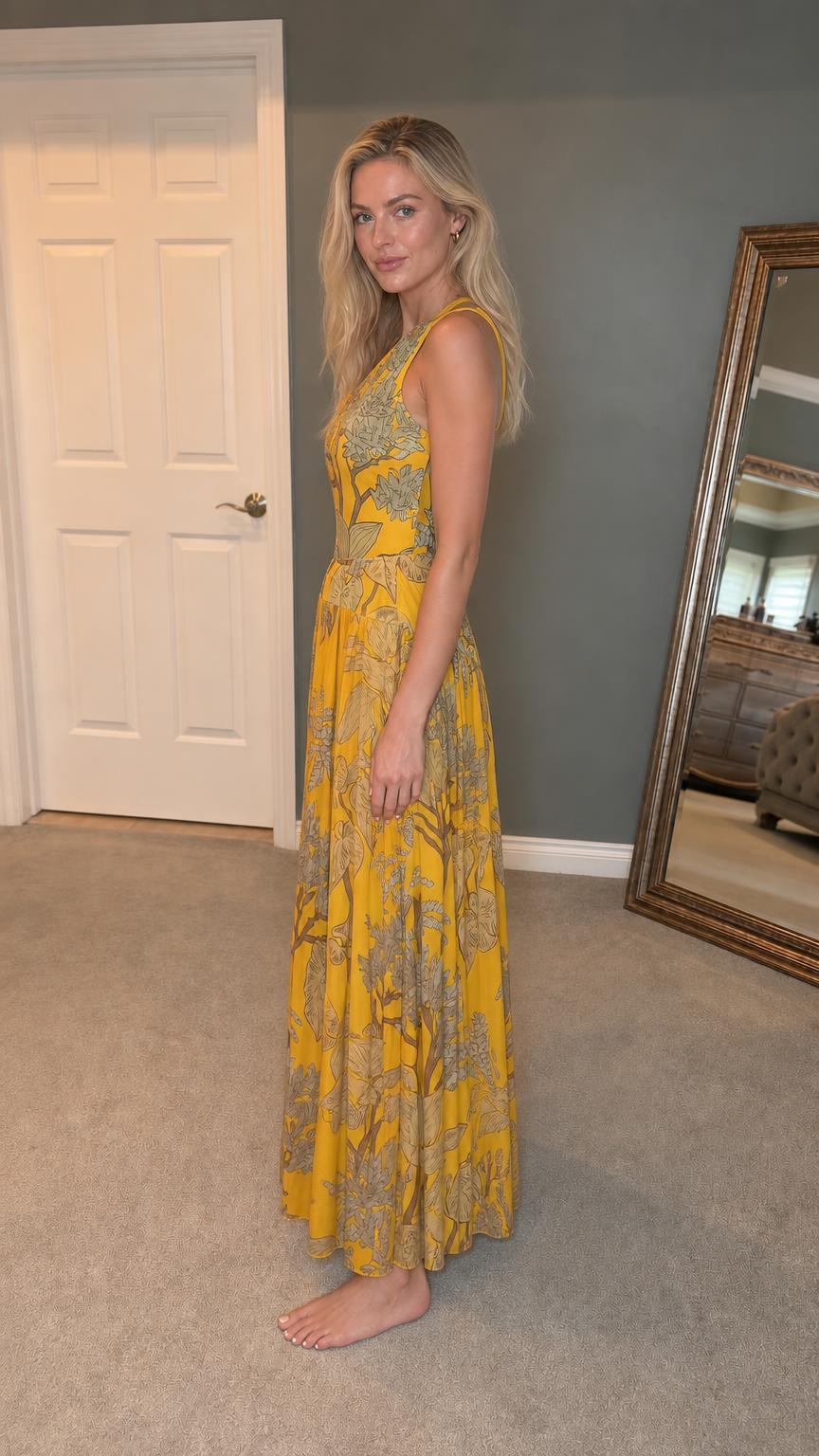 Side profile view of yellow botanical maxi dress