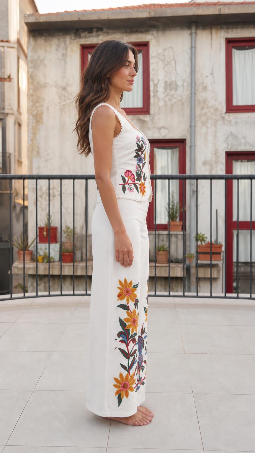 Side profile view of white floral embroidered pant set