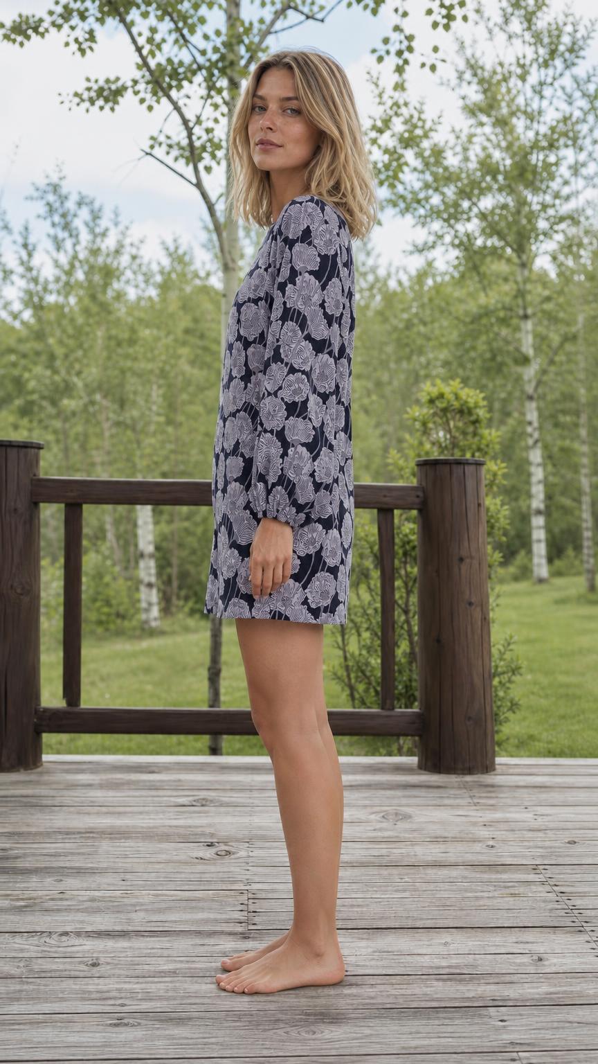 Side profile view of woman in navy floral shift dress