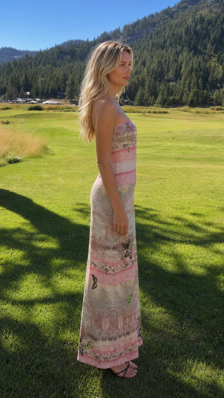 Side profile view of model in pink strapless maxi dress