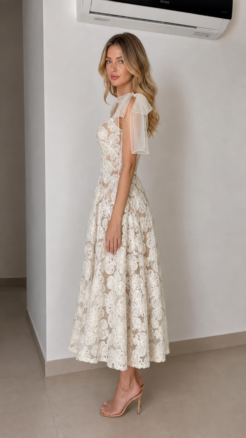 Side profile of ivory floral midi dress