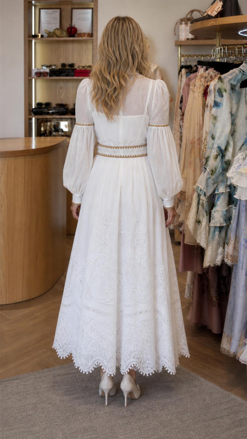 Back view of model wearing white maxi dress with belt