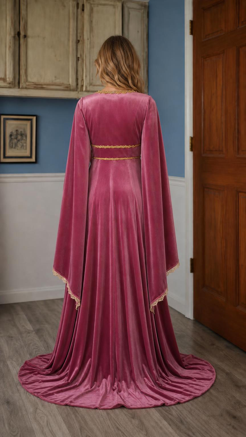 Back view of pink costume gown with cape