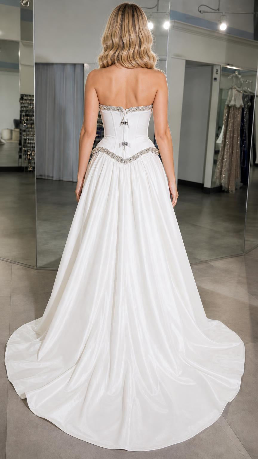 Back view showcasing sweeping satin train and corset back