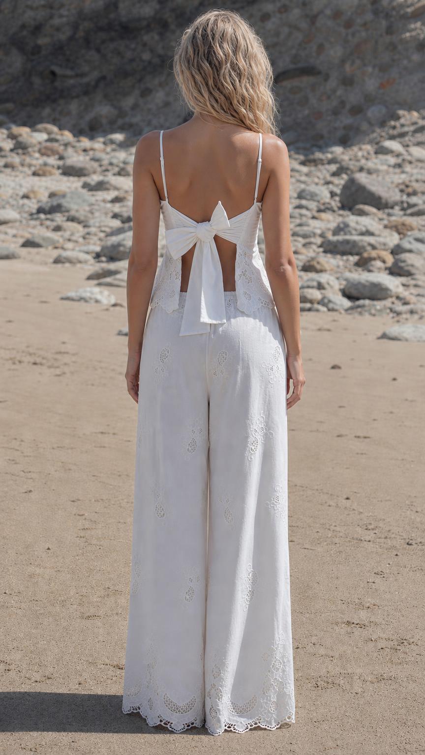 Back view of woman showing tie-back detail on white tank top