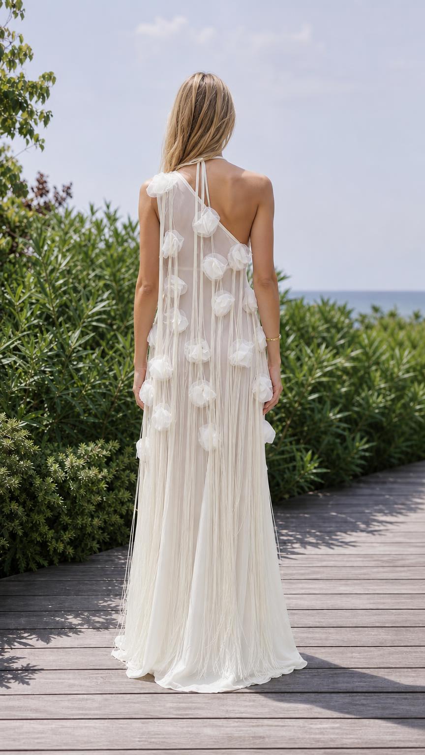 Back view of white floral applique evening gown