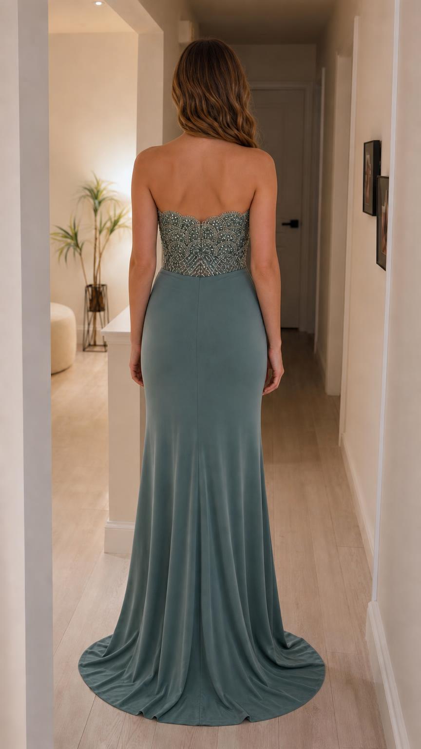 Back view of sage green strapless formal gown