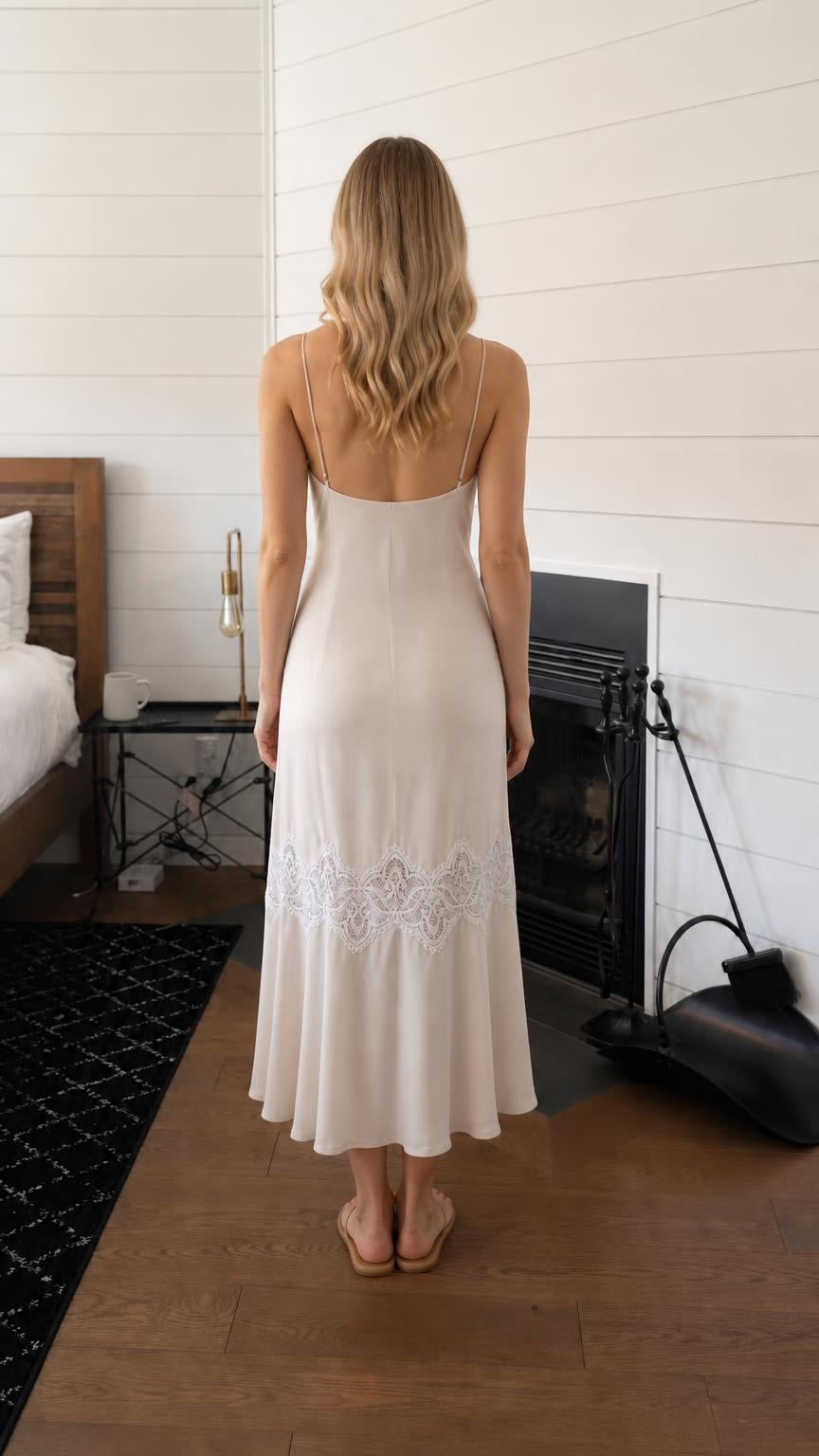 Back view of woman in beige midi dress