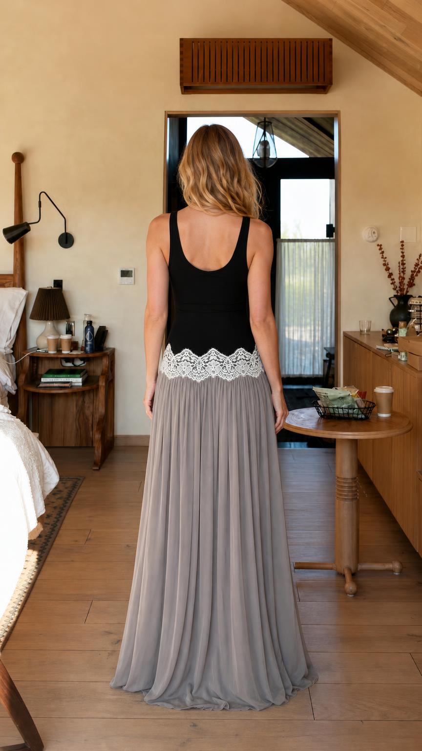 Back view of woman wearing black and grey maxi dress