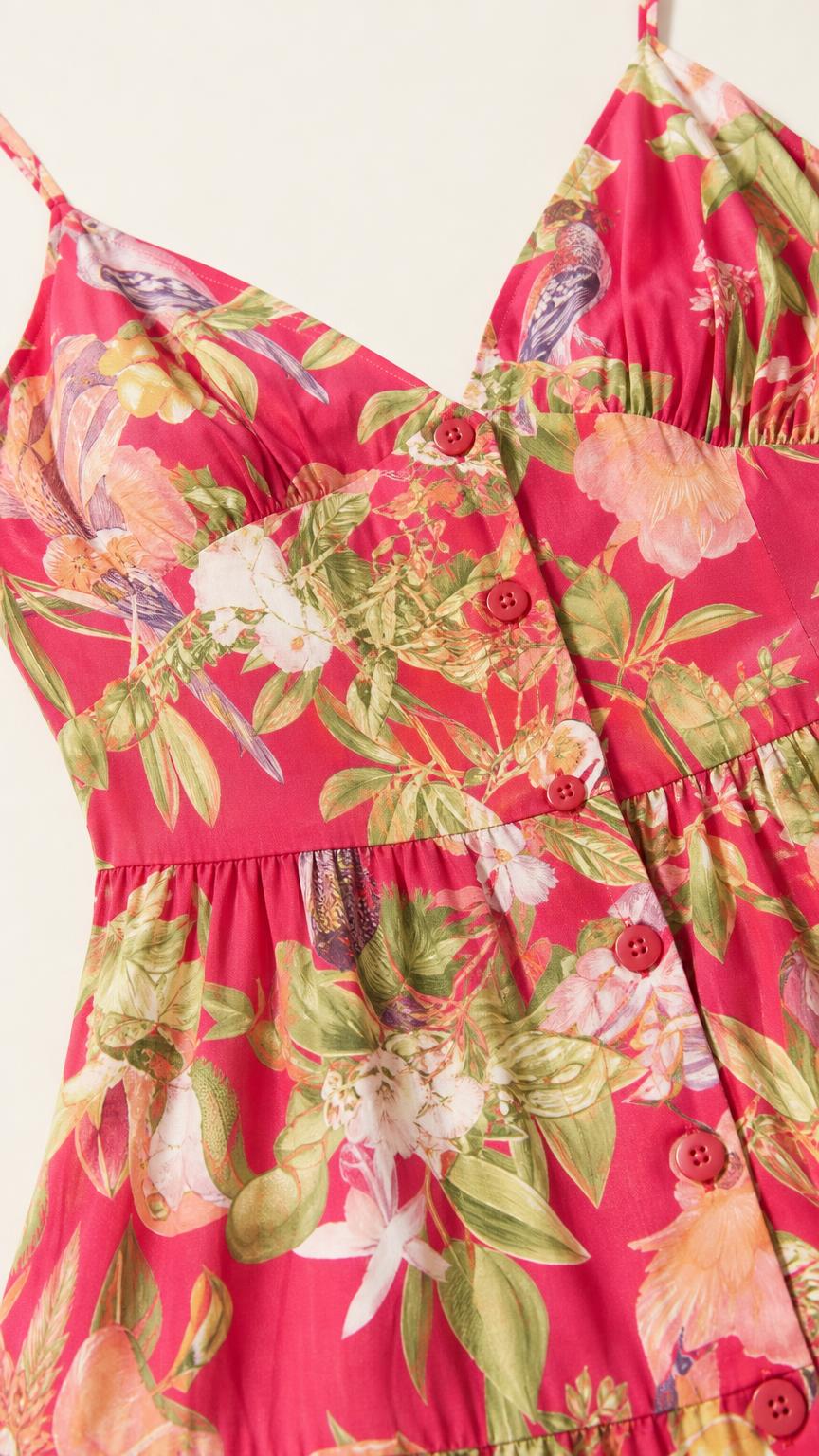 Close-up detail of bodice, straps, and buttons on fuchsia dress