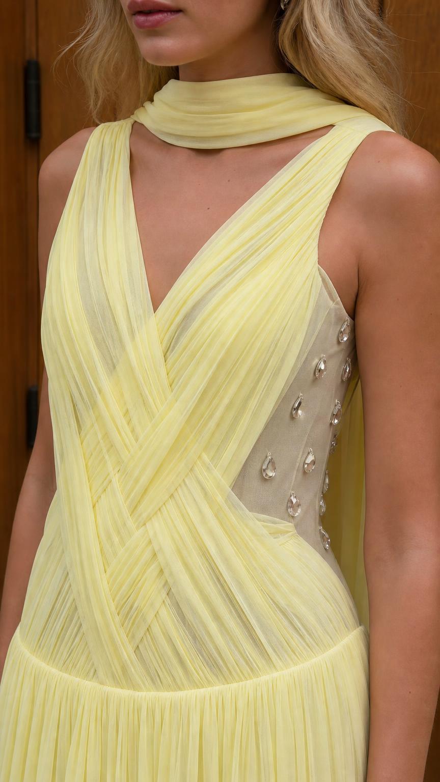 Close-up of yellow dress bodice with ruching and crystal side panel