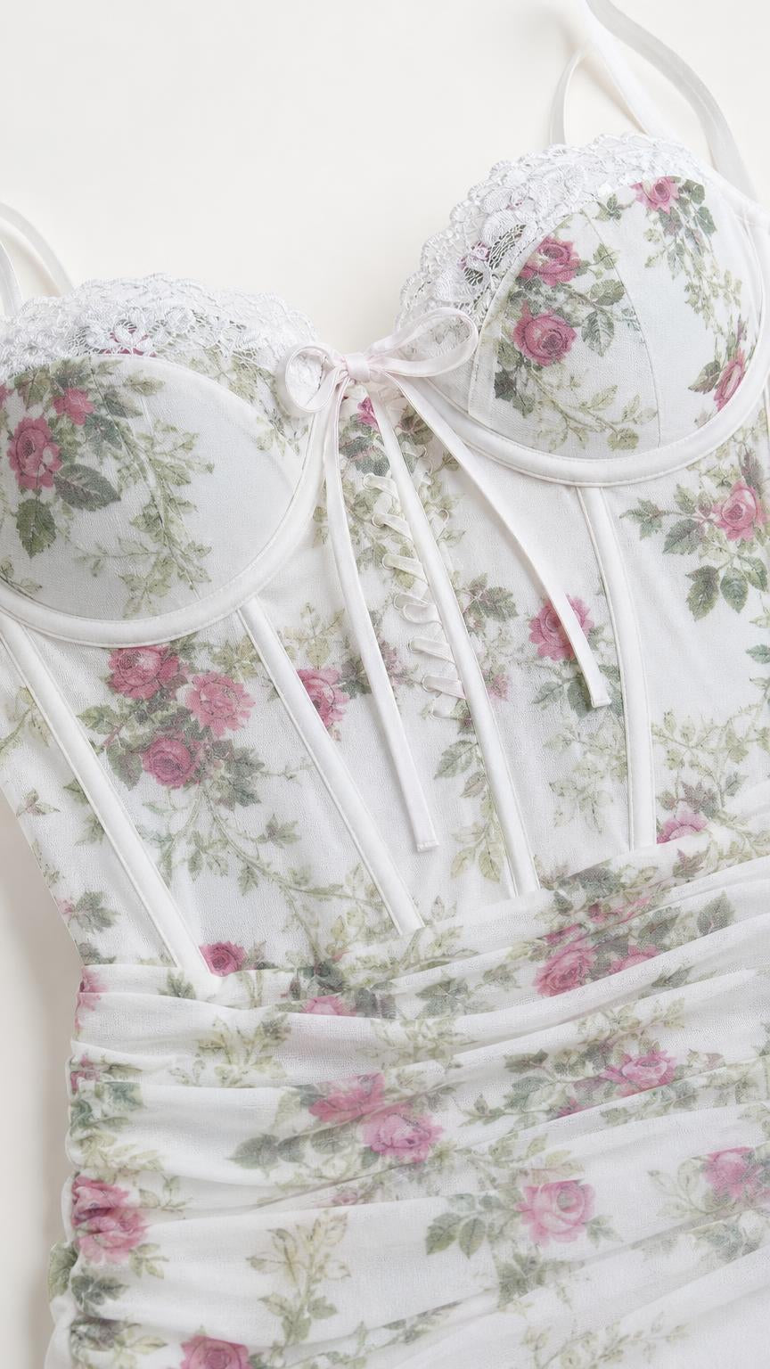 Close-up detail of bodice, boning, and lace trim on White floral dress