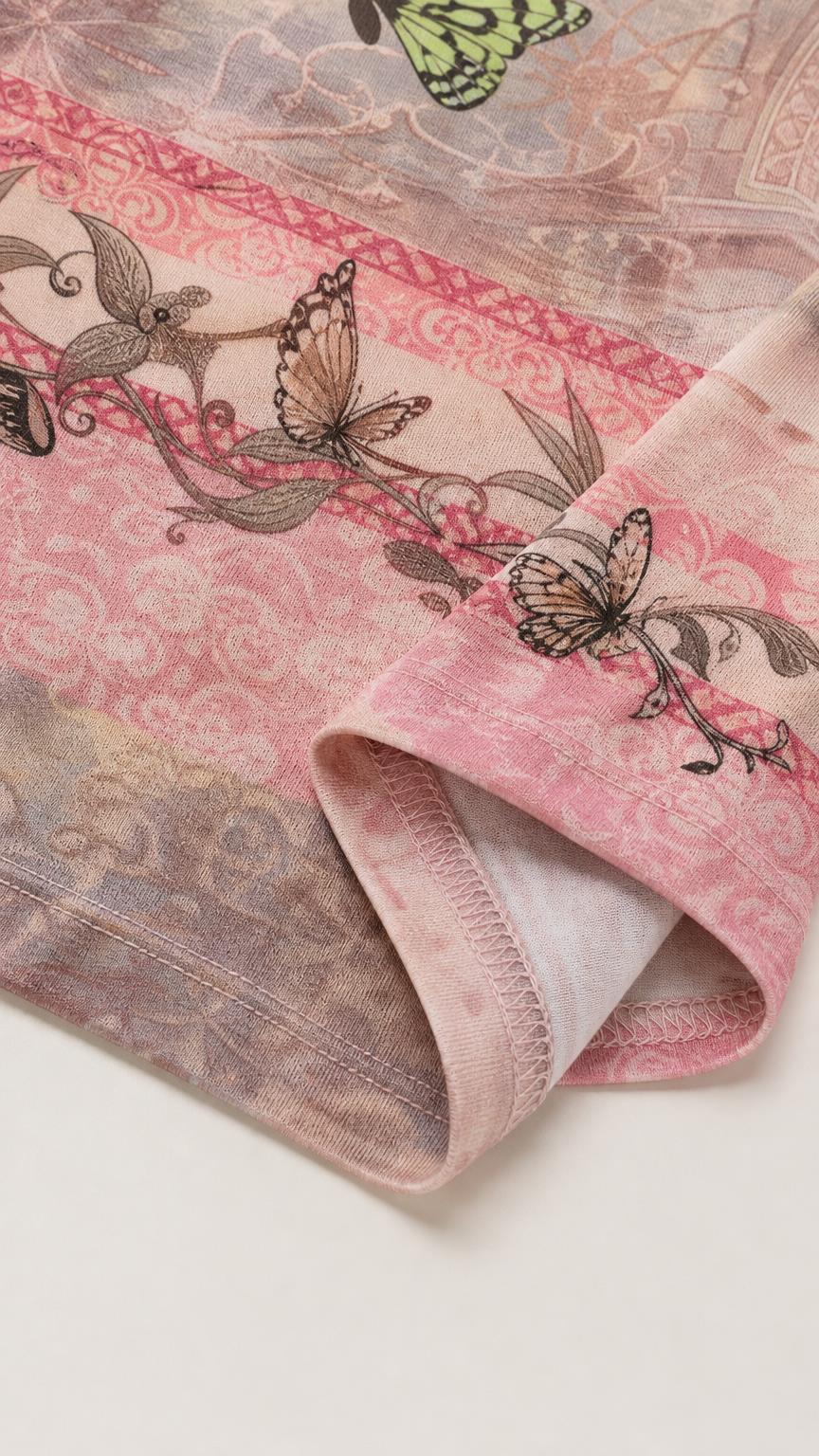 Close-up detail of the pink butterfly print fabric and hem