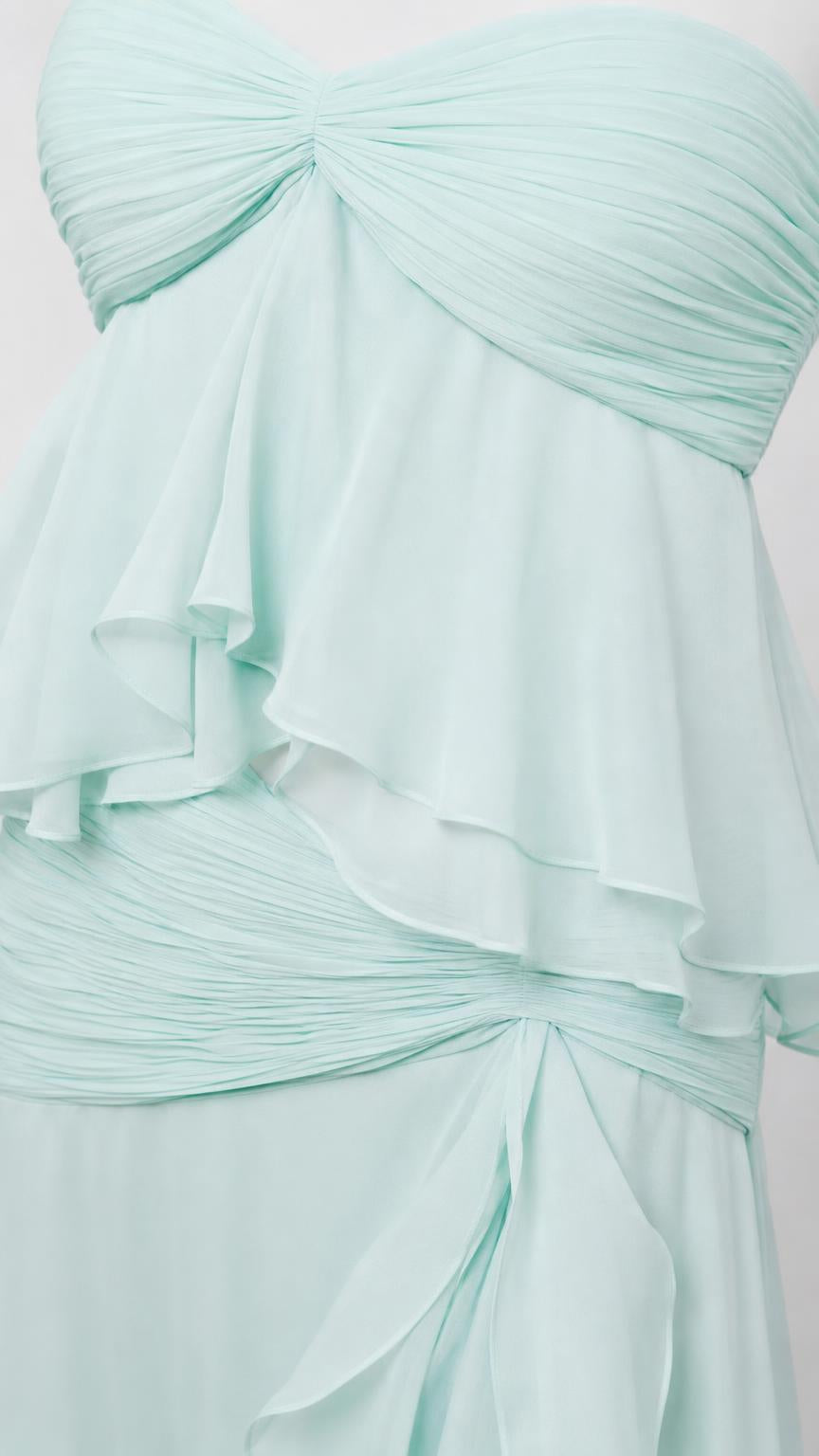 Close-up detail of bodice and ruffles on mint green dress