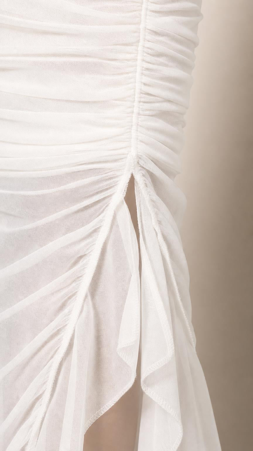 Close-up detail of side slit and mesh ruching on White dress
