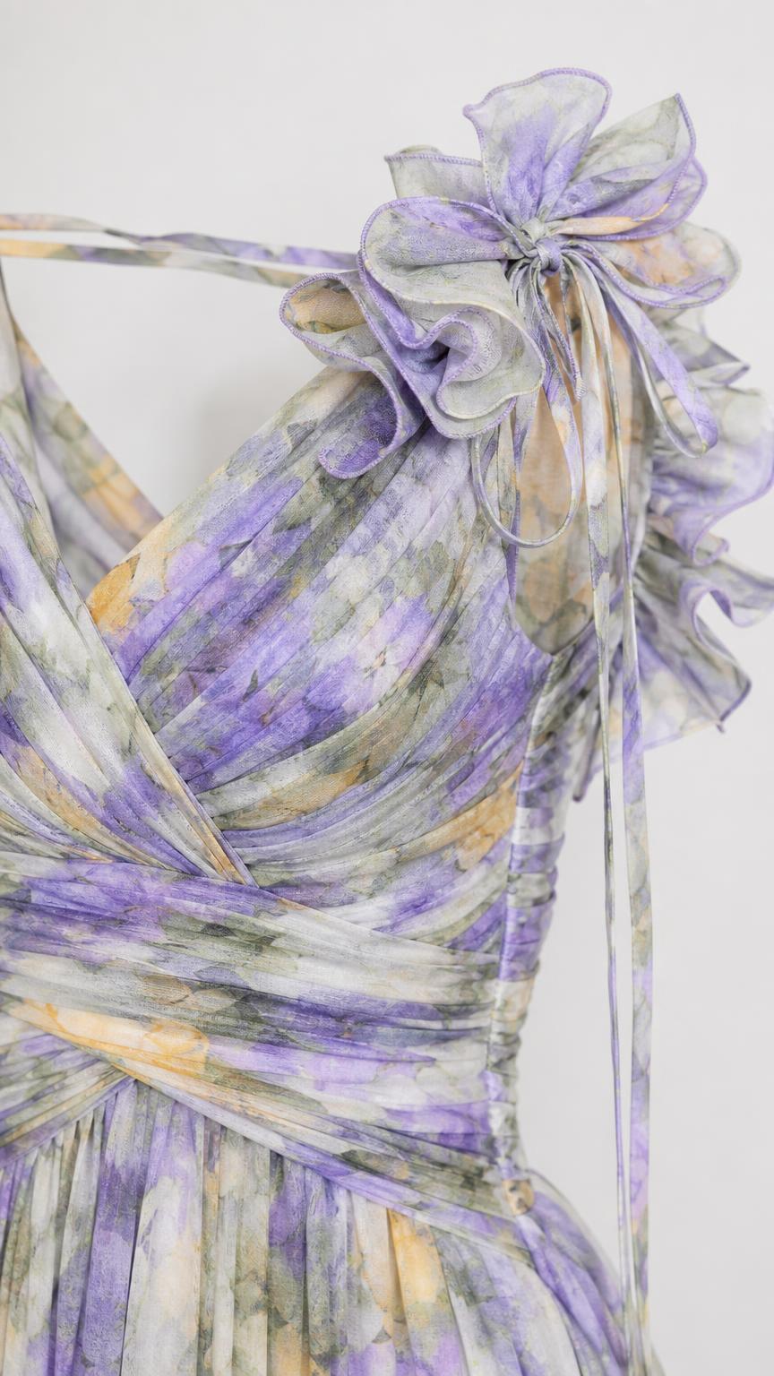 Close-up of shoulder ruffle and pleated bodice details