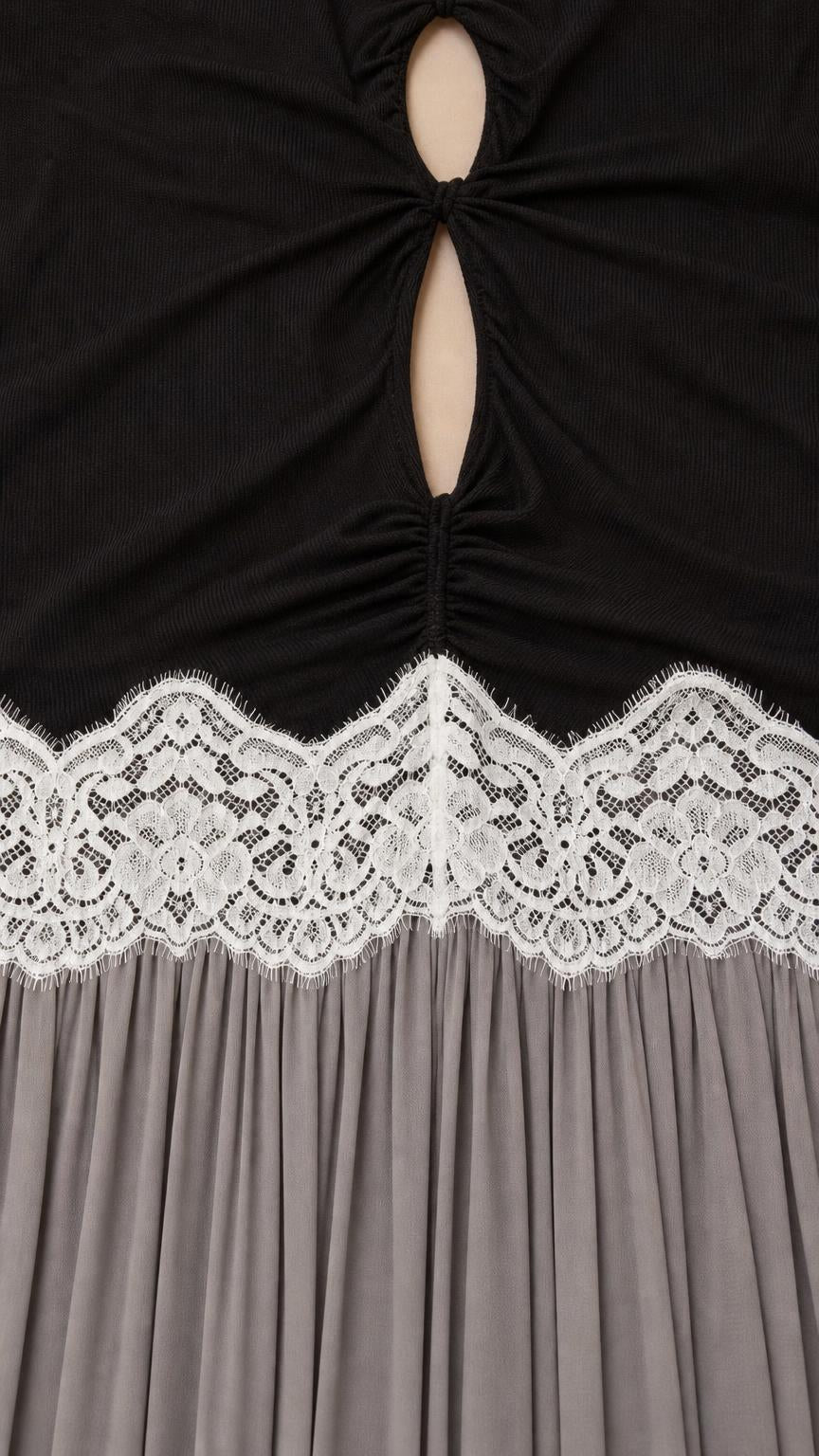 Close-up of bodice cutout and white lace waist trim