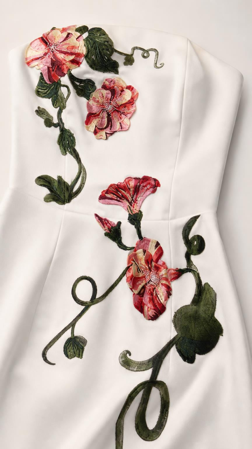 Close-up detail of embroidered floral appliques