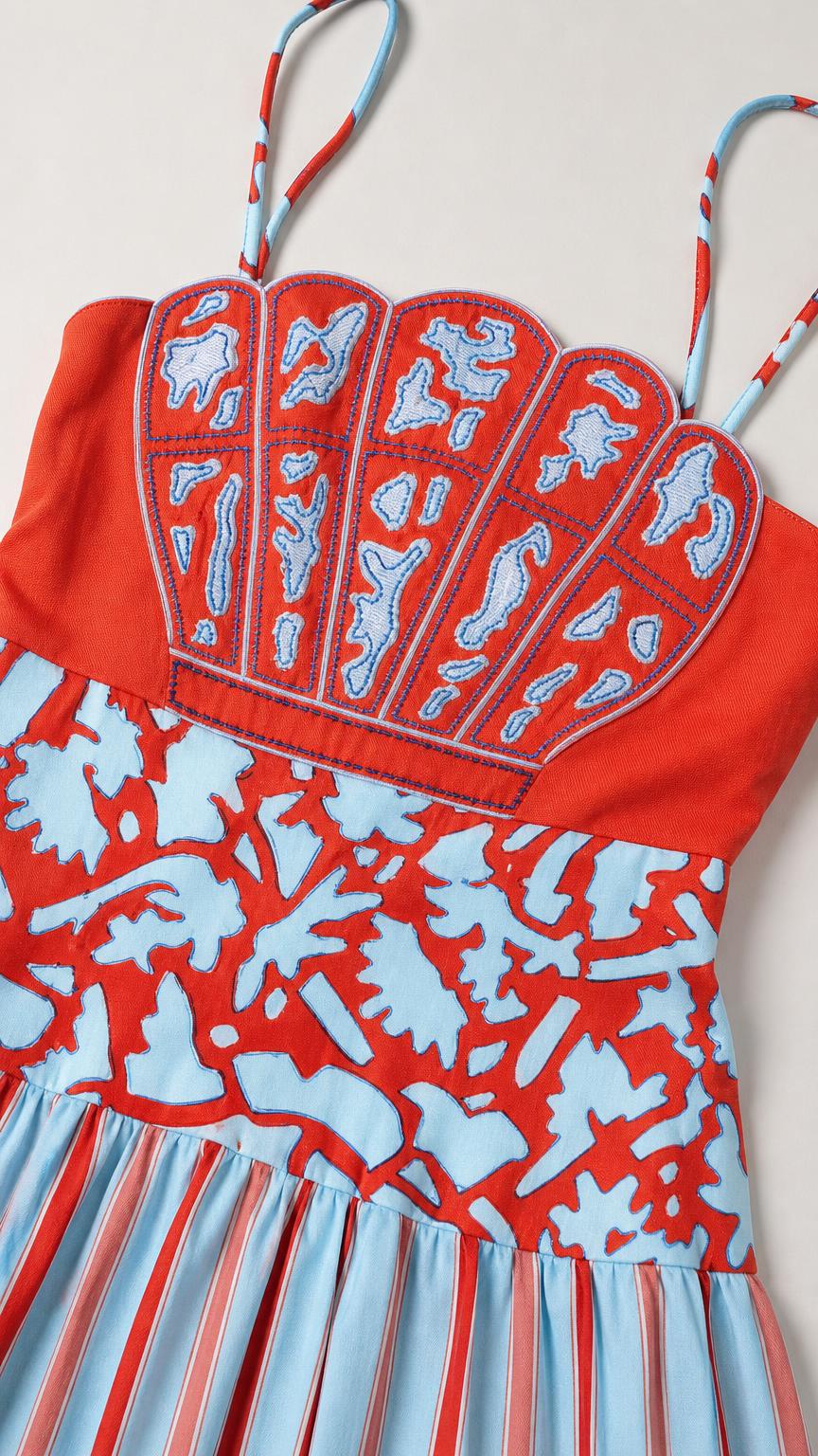 Close-up detail of seashell embroidery and straps