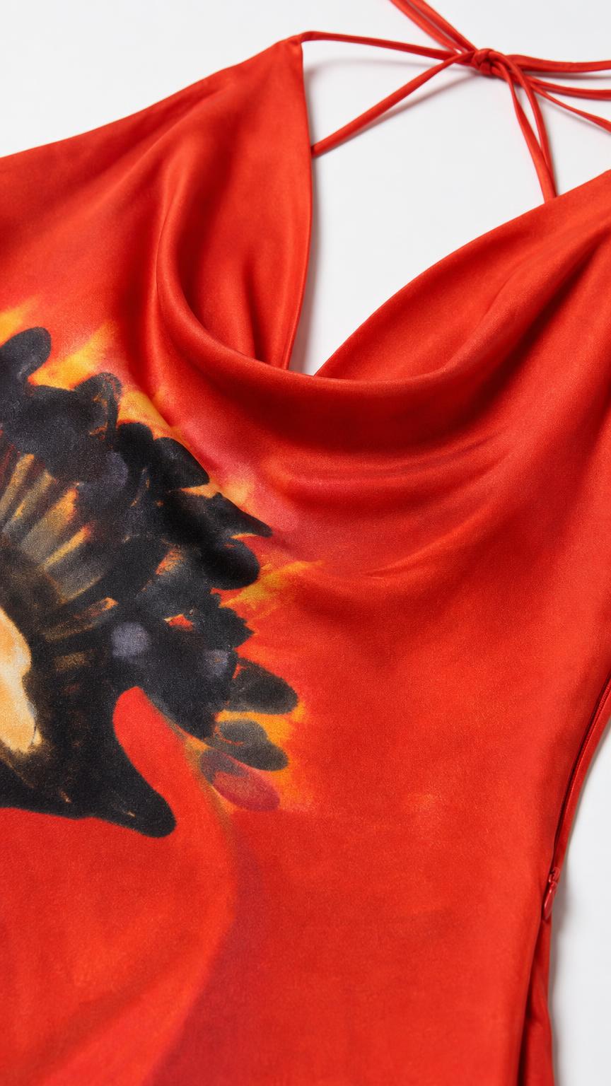 Close up of red cowl neckline and fabric texture