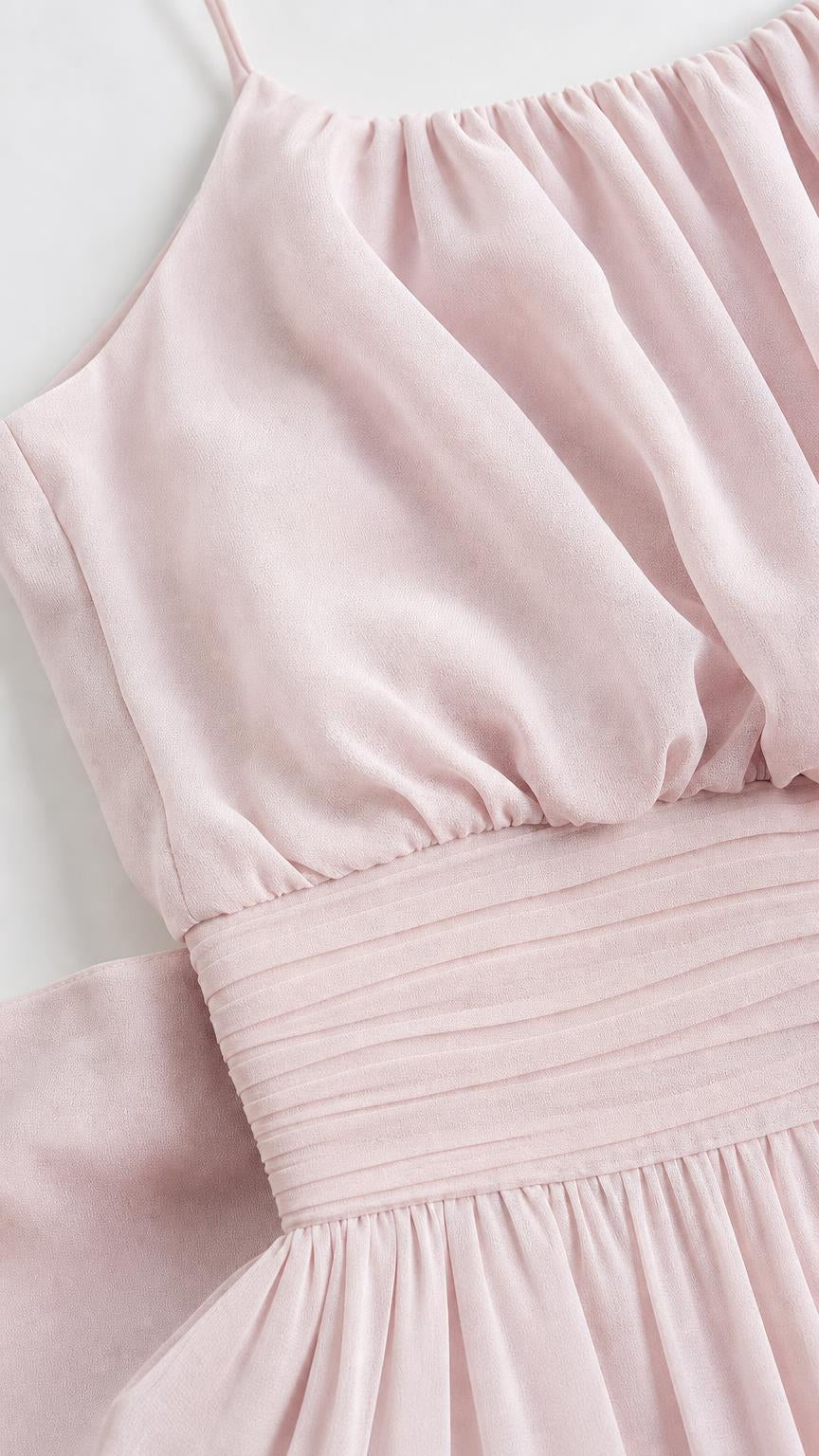 Close up of gathered neckline and pleated waistband in pink