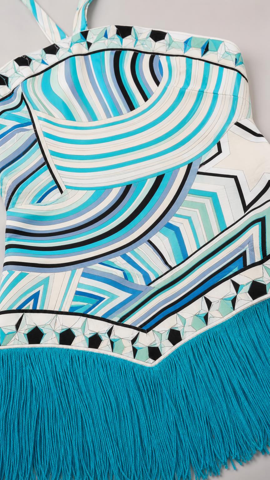 Close up fabric detail of Blue geometric pattern and fringe