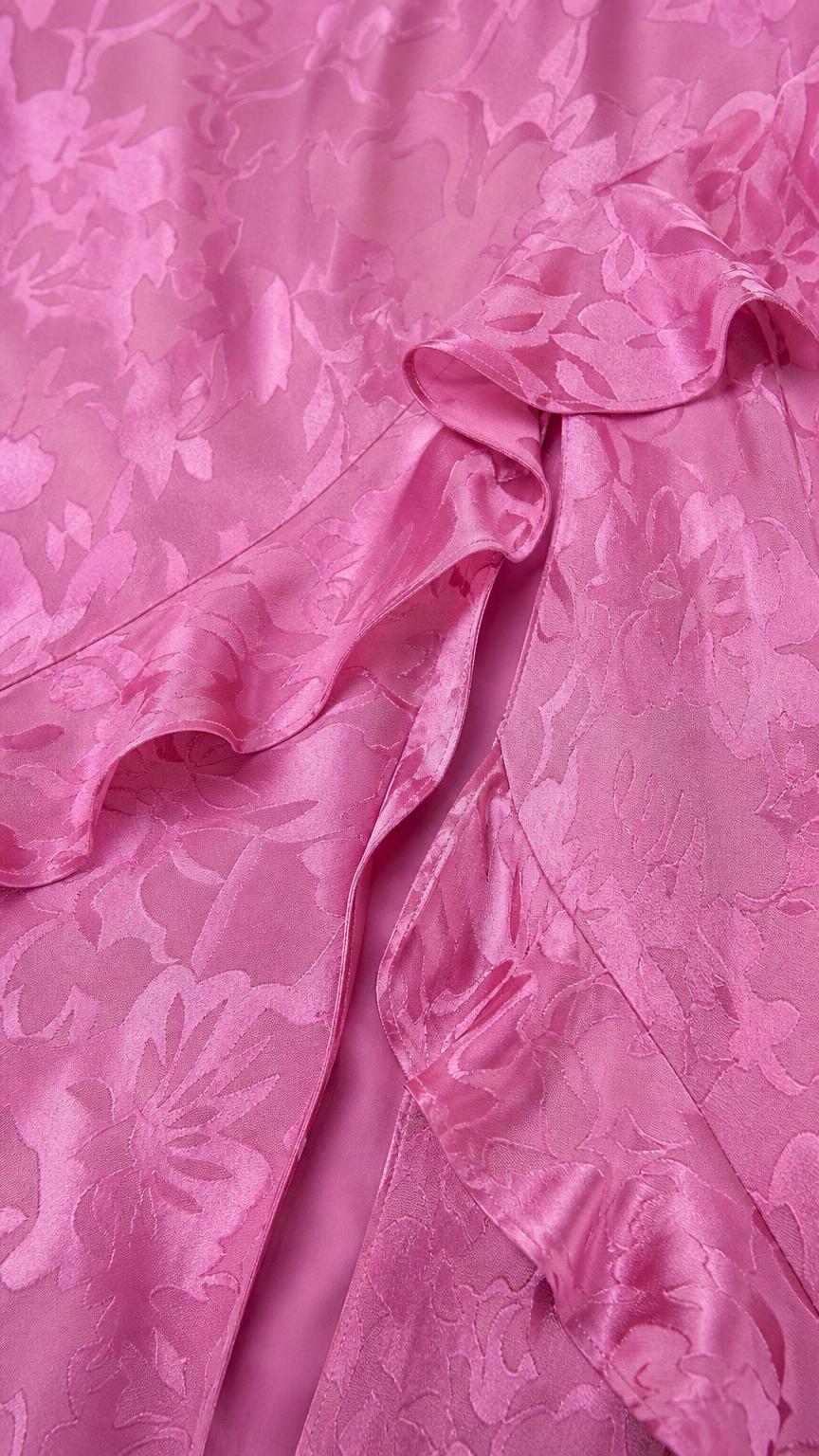 Close-up detail of tonal floral jacquard texture and ruffles