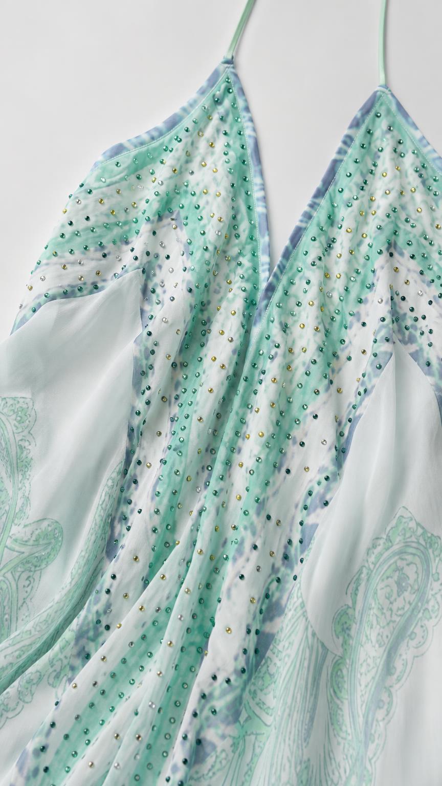 Close-up of embellished neckline and paisley print