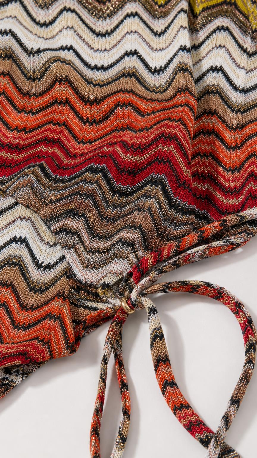Close-up detail of the multi-color textured chevron knit fabric and tie closure
