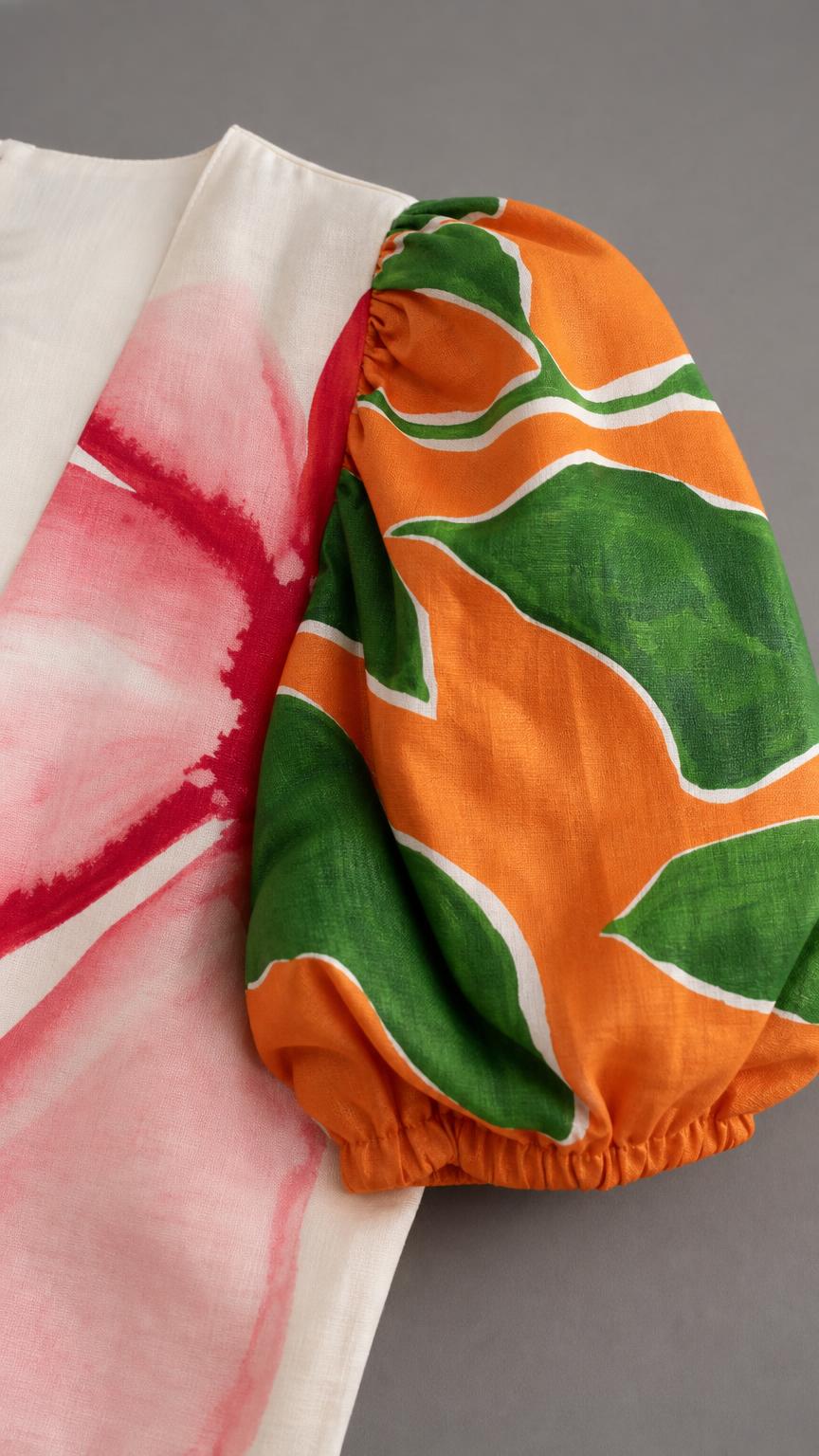 Close-up detail of the colorful puff sleeve and fabric
