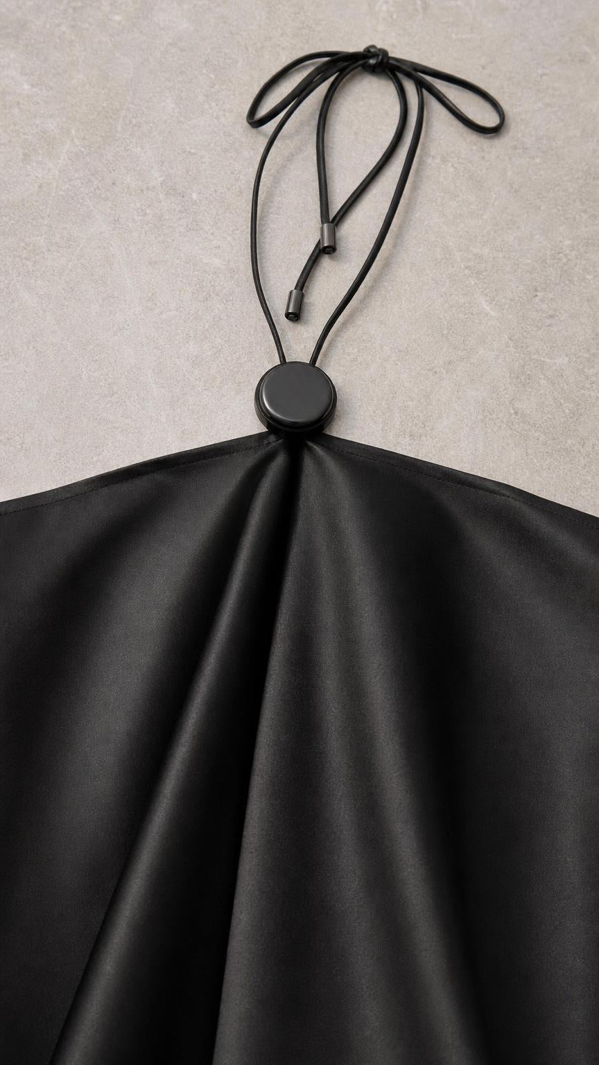 Close-up of halter neck clasp and adjustable straps